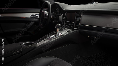 Modern car inside. Control panel and automatic transmission background.