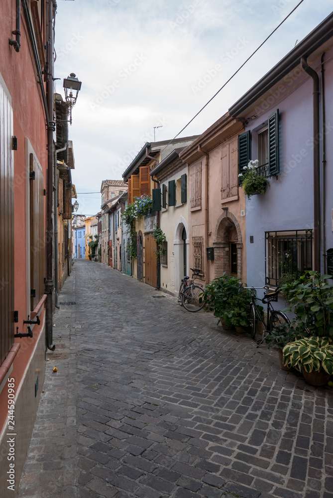 Fototapeta premium A picturesque narrow street in the ancient district of San Giuliano