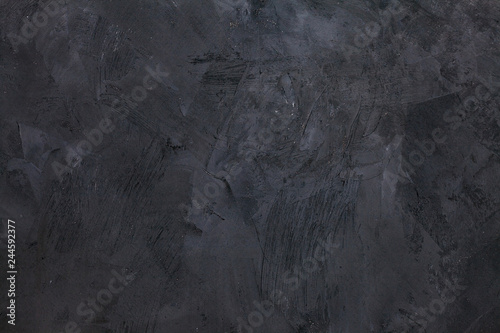 Abstract black background with rough distressed aged texture, grunge charcoal...