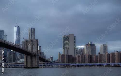 View of the Brooklyn Bridge and Manhattan from the riverside of the East River at sunset - 10