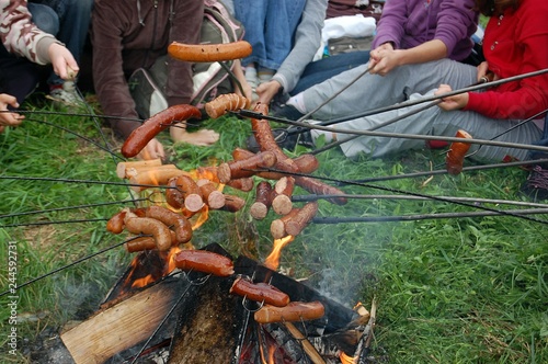 roasting sausages on a sticks