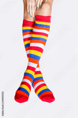 Beautiful female legs in colorful stockings