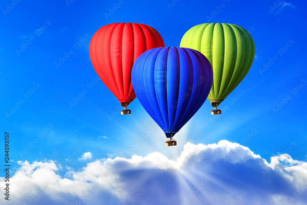 Fototapeta premium Three bright hot air balloons on the sky, symbol of the RGB color scheme