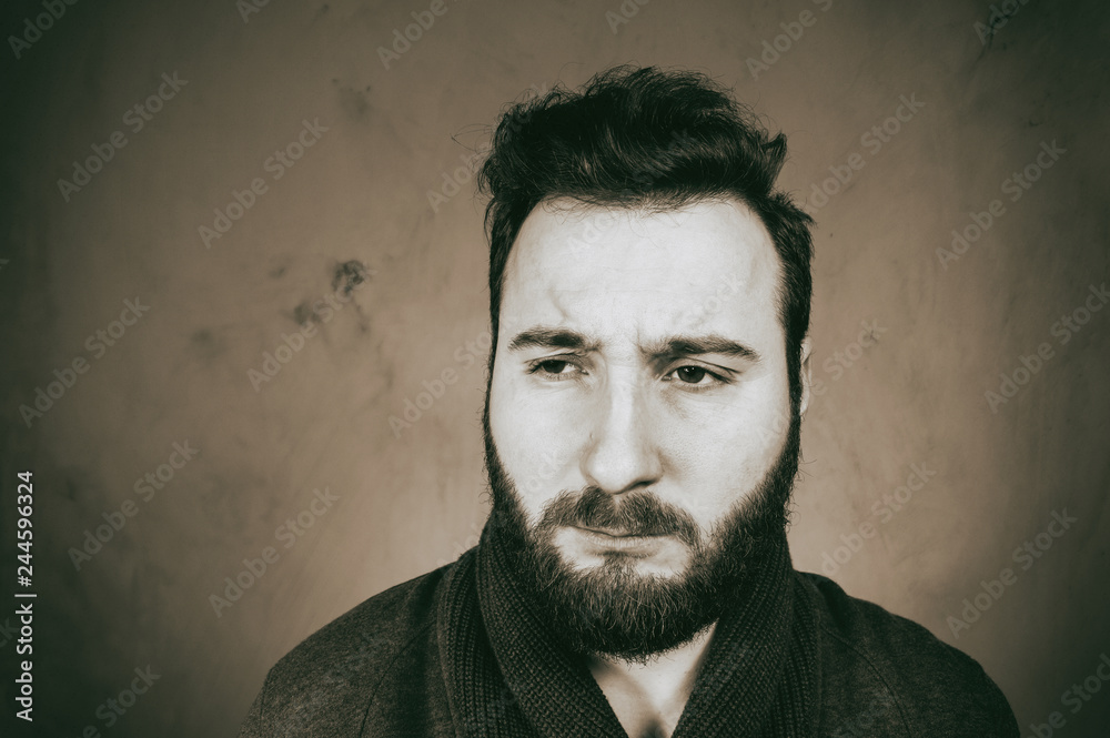 Fototapeta premium Black and white portrait of a sadness man with headache.