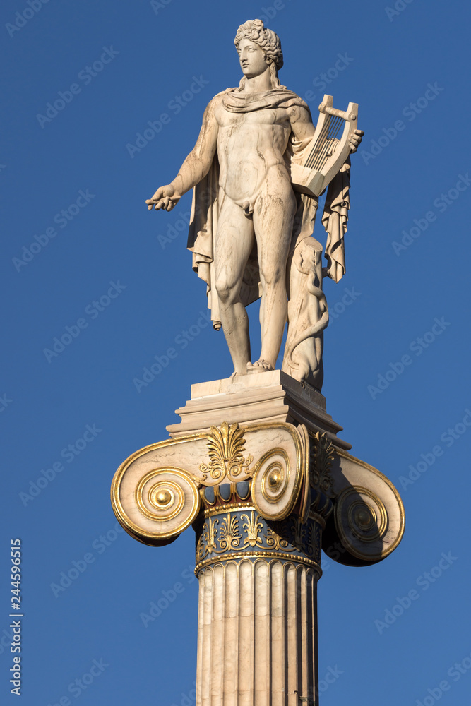Sunset view of Statue of the ancient Greek god Apollo in front of Academy of Athens, Attica, Greece Sunset view of Statue of the ancient Greek god Apollo in front of Academy of Athens, Attica, Greece