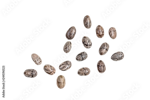 Small group of chia seeds spread out and isolated on white background