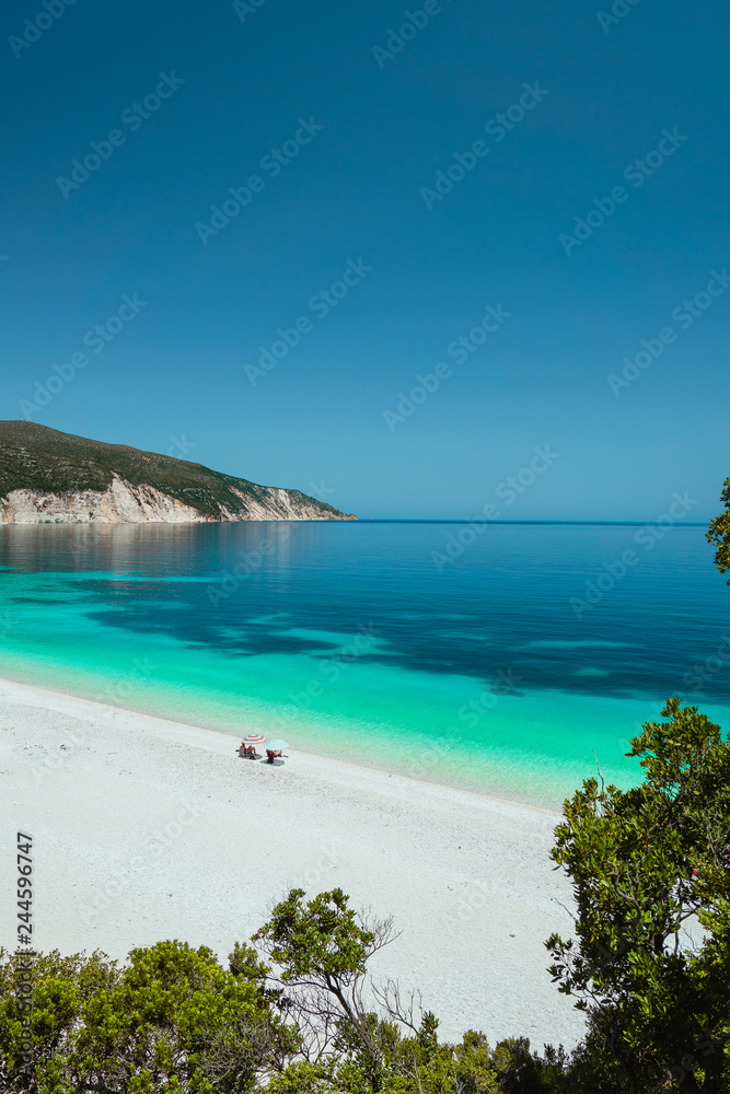 Couple enjoying the summer on one of the most beautiful beaches of Greece on Kefalonia Island Ionian islands. Summer adventure vacation holiday luxury travel romantic honeymooning concept