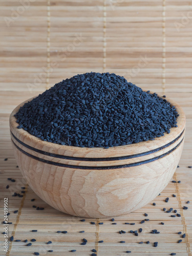 Black sesame in a wooden bowl.
