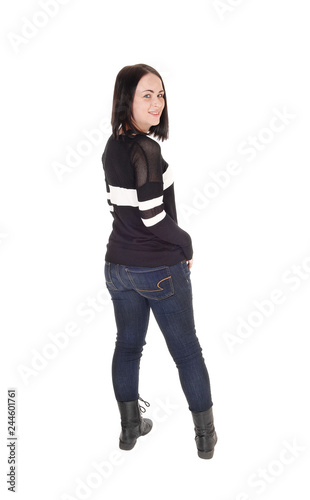 Pretty young woman standing in jeans from back © 80Feierabend
