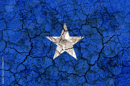 somalia country flag painted on a cracked grungy wall photo