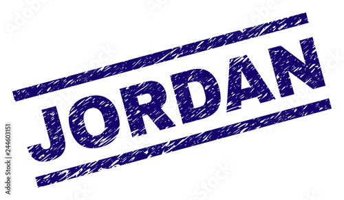 JORDAN seal print with distress style. Blue vector rubber print of JORDAN tag with retro texture. Text tag is placed between parallel lines.