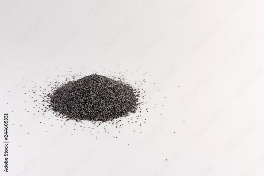 Pile of poppy seeds isolated on white Pile of poppy seeds isolated on white