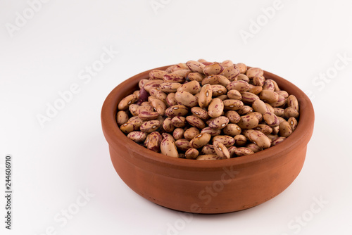 A plate of beans on white background
