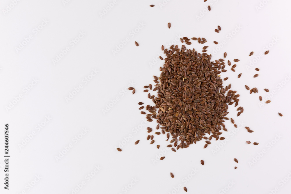 pile of flax seeds isolated on white background pile of flax seeds isolated on white background
