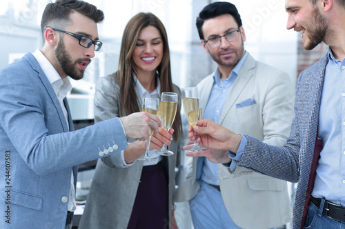 close up.glasses of champagne in the hands of the business team.