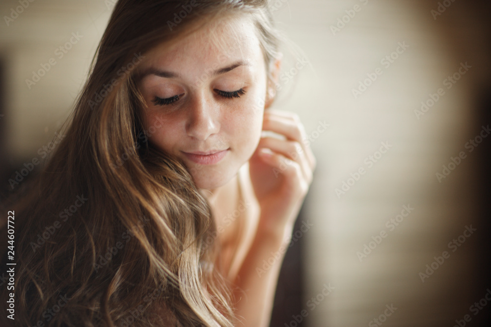 Beautiful young girl posing in home photo studio Beautiful young girl posing in home photo studio