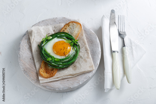 Green beans with sunny side fried egg on toast