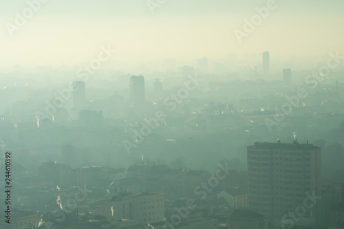Urban landscape with smog. Aerial view of city with polluted air.