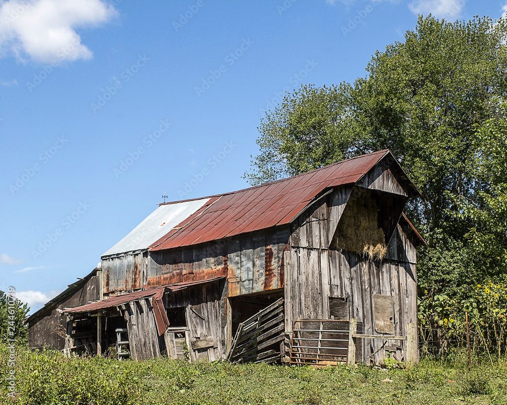 Aging barn and hayloft in a rural area. Aging barn and hayloft in a rural area.