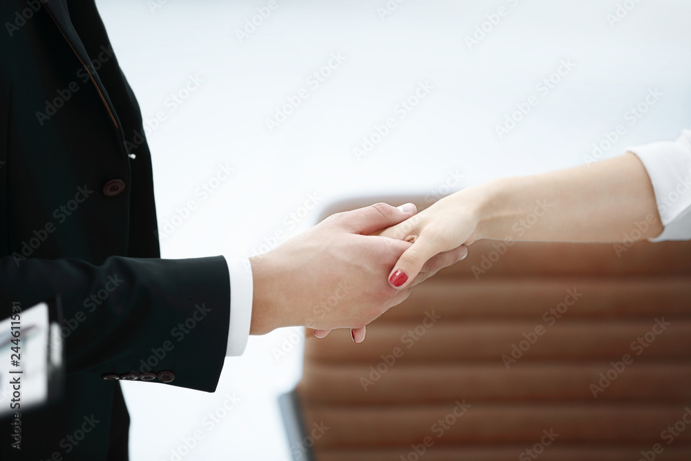 Obraz premium closeup .welcoming handshake of a businessman and business woman