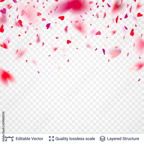 Heart shaped pink red confetti blurred in motion.