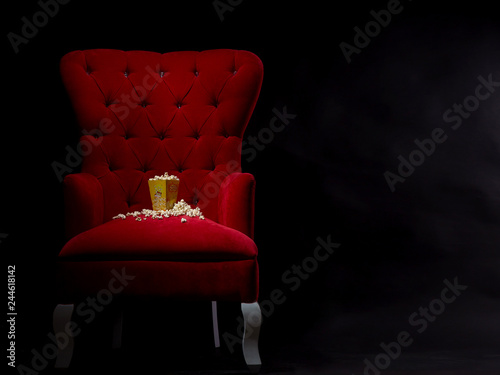 popcorn in red sofa