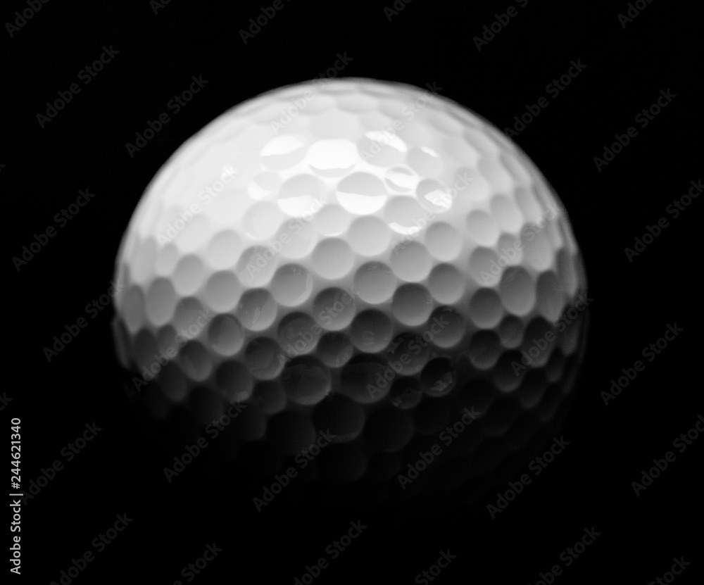 Close Up of Golf Ball, Isolated on Black Background Close Up of Golf Ball, Isolated on Black Background