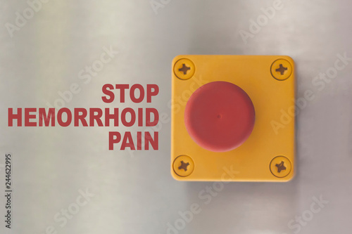 Industrial switching button with text: stop hemorrhoid pain photo