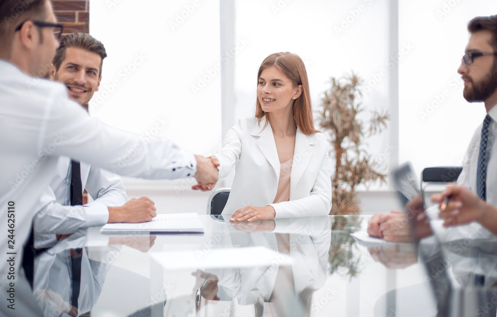 handshake business people in a modern office handshake business people in a modern office