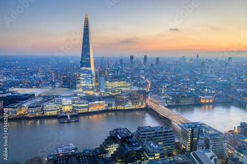 view of London skyline at sunset photo