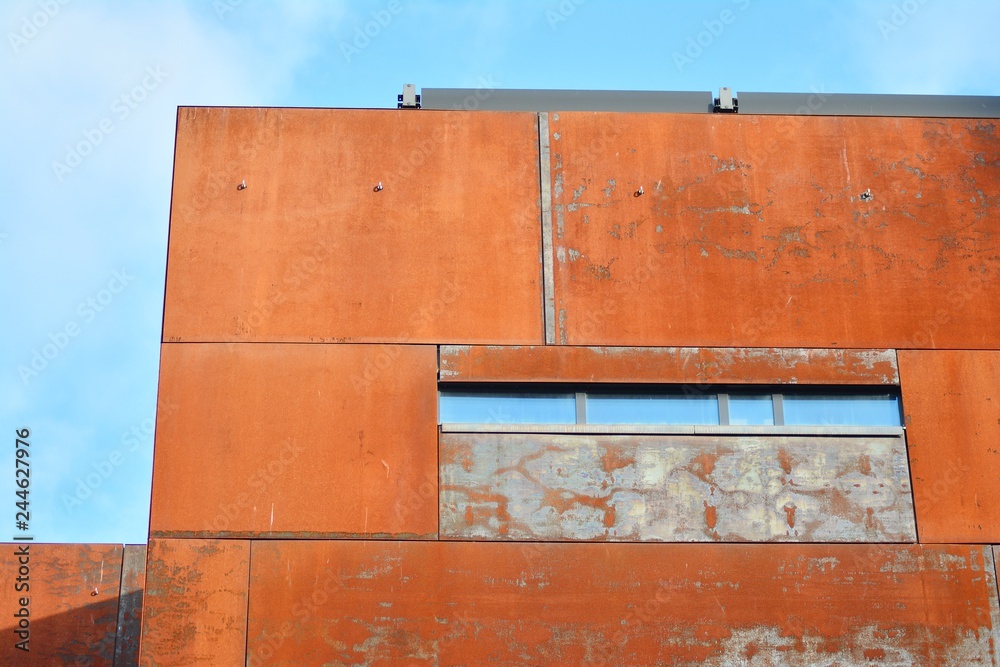 Modern building with rusty facade exteriors Modern building with rusty facade exteriors