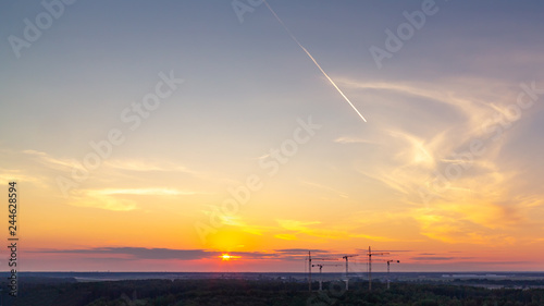 Panoramic view of the horizon and colorful sunset on the outskirts of the city