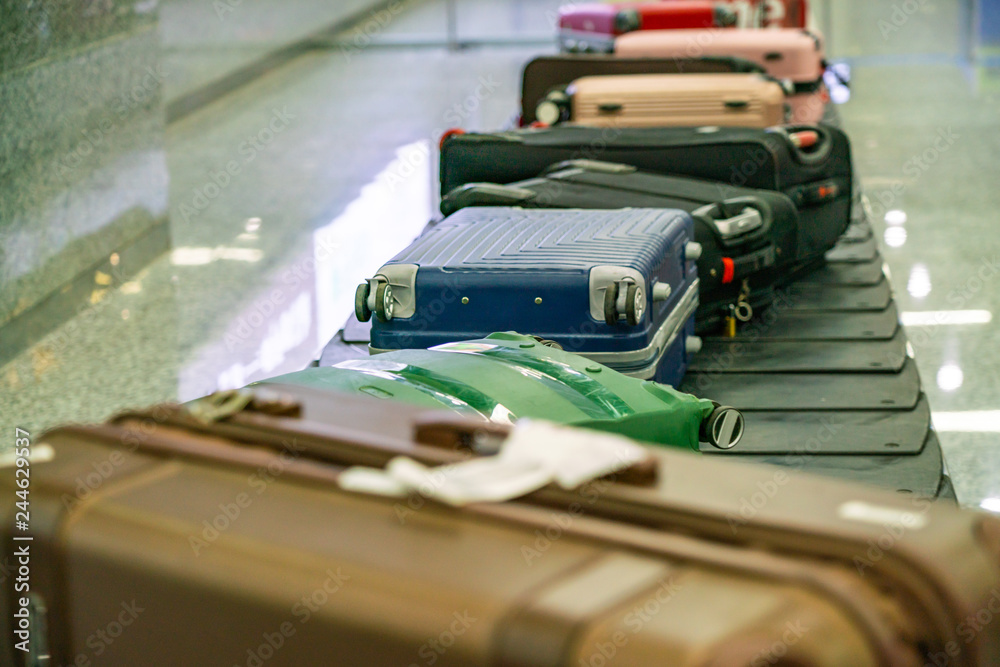 Many suitcase and luggage in line in the international airport
