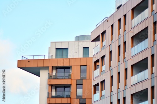 Modern apartment buildings on a sunny day with a blue sky. Facade of a modern apartment building