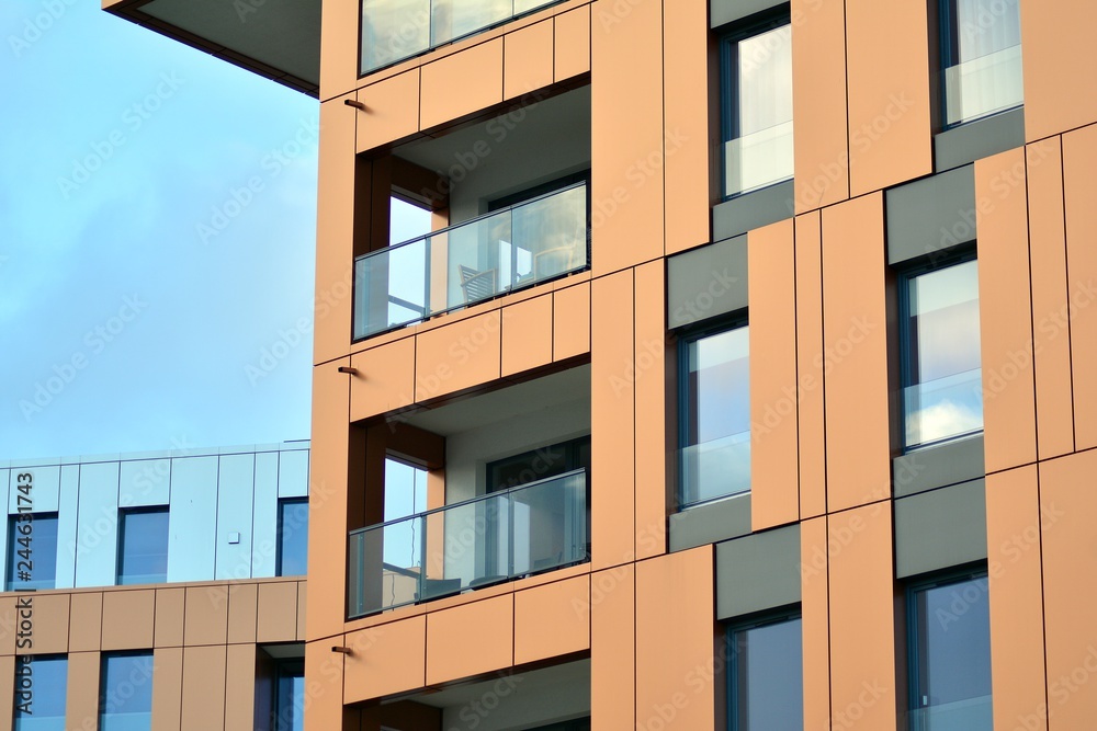 Modern apartment buildings on a sunny day with a blue sky. Facade of a modern apartment building Modern apartment buildings on a sunny day with a blue sky. Facade of a modern apartment building
