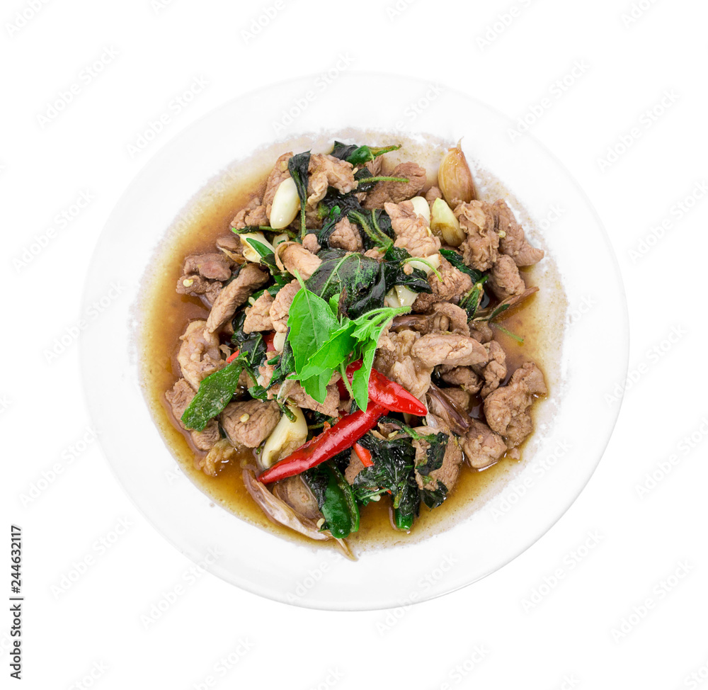 Stir-fried pork with basil leaves isolated on white background Stir-fried pork with basil leaves isolated on white background