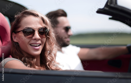 close up.a young woman and her boyfriend were traveling in a convertible car © ASDF