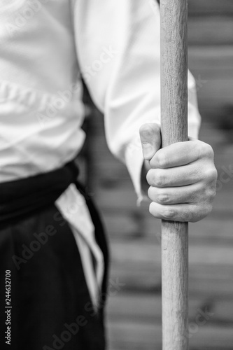 Φωτογραφία Wooden training sword bokken and jo in cover isolated on white background