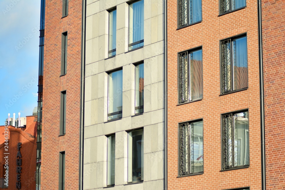 Modern apartment buildings on a sunny day with a blue sky. Facade of a modern apartment building