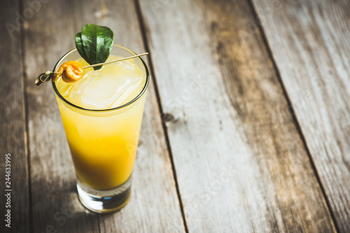 Fresh cocktail with mandarines on the rustic background. Selective focus. Shallow depth of field.