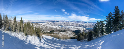 Panoramic view of Wasatch mountains at winter time as seen from Deer Valley resort.
