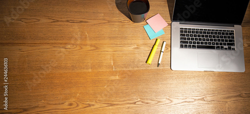 Very Wide Top View of Work Desk with Copy Space, Laptop, Pen, Coffee