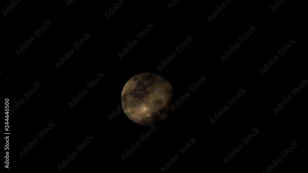 close up of clouds drifting over and covering the full super moon on a dark sky night during an eclipse, January 20 2019 in the sky in Northern Thailand. close up of clouds drifting over and covering the full super moon on a dark sky night during an eclipse, January 20 2019 in the sky in Northern Thailand.