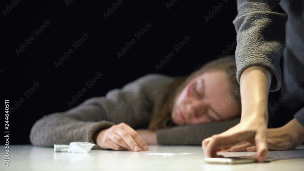 Sister calling 911 for drug addicted woman suffering strong intoxication, aid Sister calling 911 for drug addicted woman suffering strong intoxication, aid