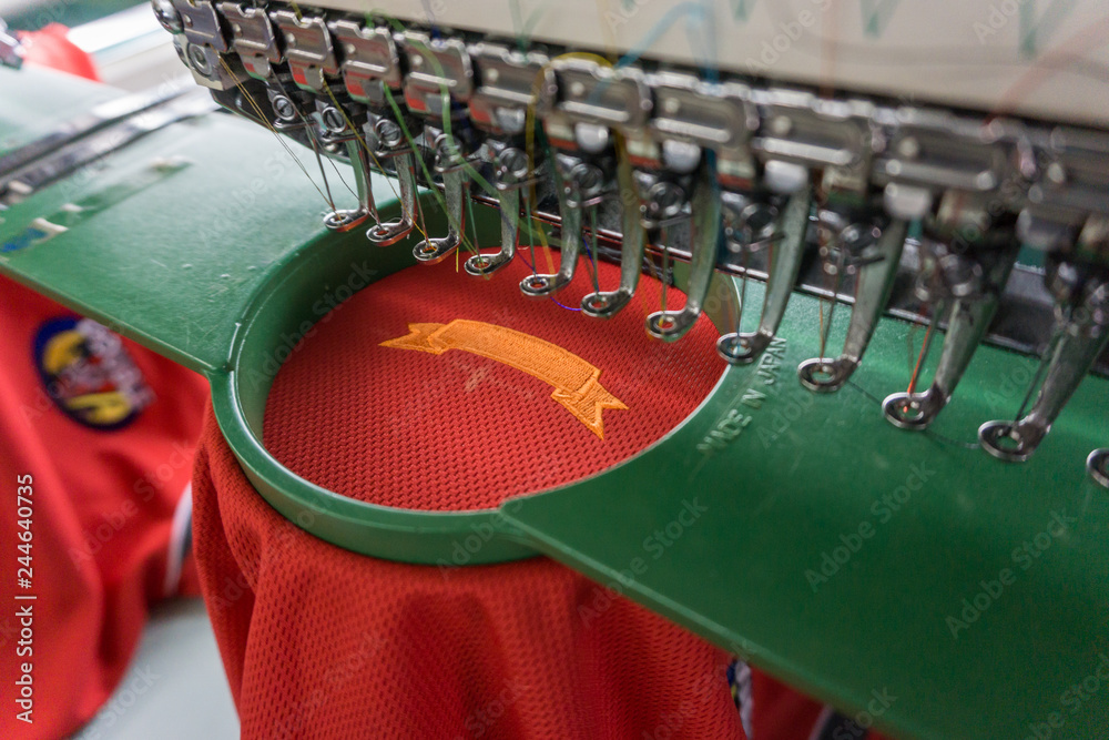 custom made wallpaper toronto digitalEmbroidery machine needle in Textile Industry at Garment Manufacturers, Embroidery T-shirt in progress, Needle with thread (selective focus and soft focus)