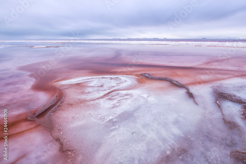 Colorful sediment in shallow saltwater in Great Salt Lake, Utah
