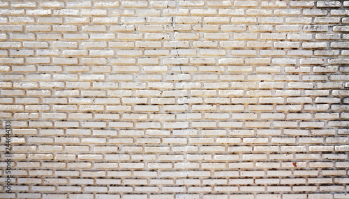 Old white brick texture wall with dirty and peeling paint 