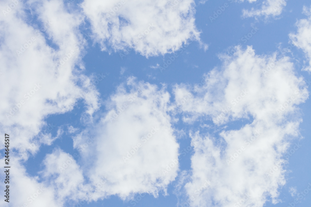 Obraz premium Beautiful blue sky background with white clouds