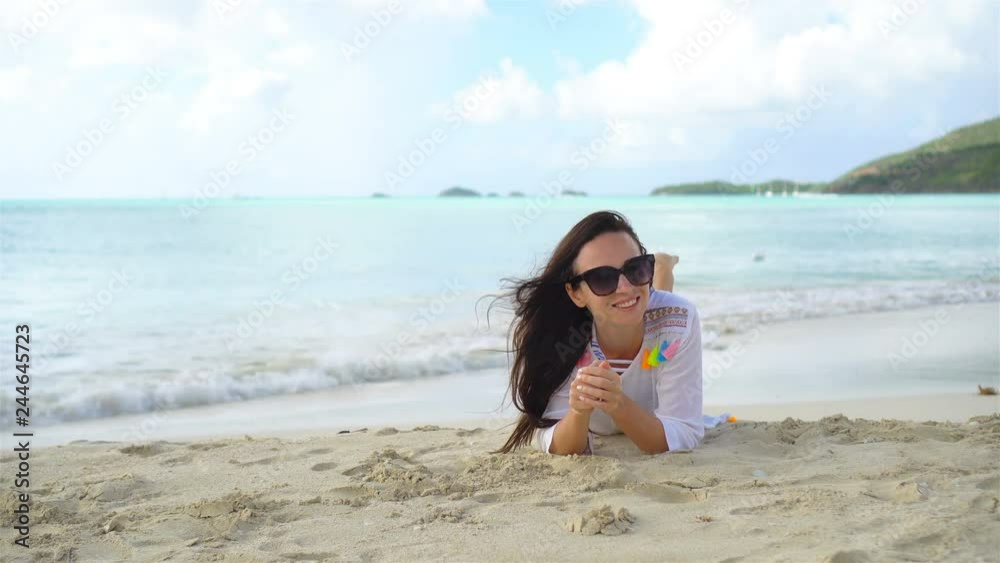 Woman on beach laughing and enjoying summer holidays l Woman on beach laughing and enjoying summer holidays l