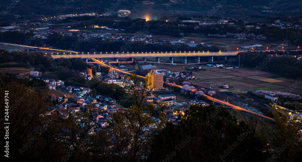 twilight city scape and highway connecting on the mountains fujiyoshida
